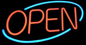 Neon "OPEN" sign in red letters on a black background